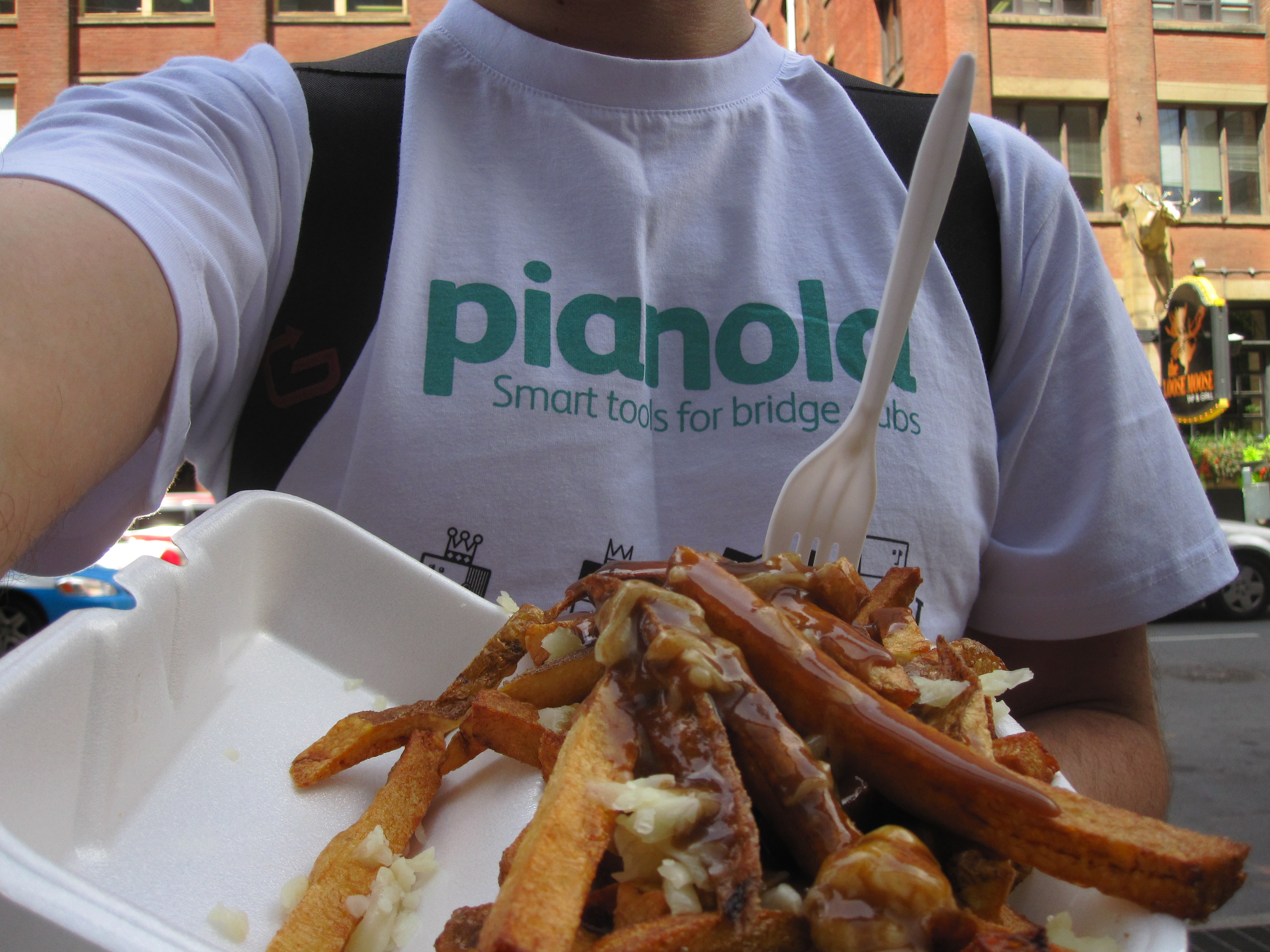 Richard Garside eating poutine in Toronto